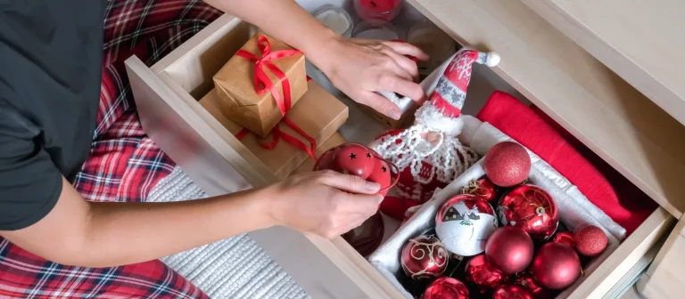 Person organizing the holiday decor storage