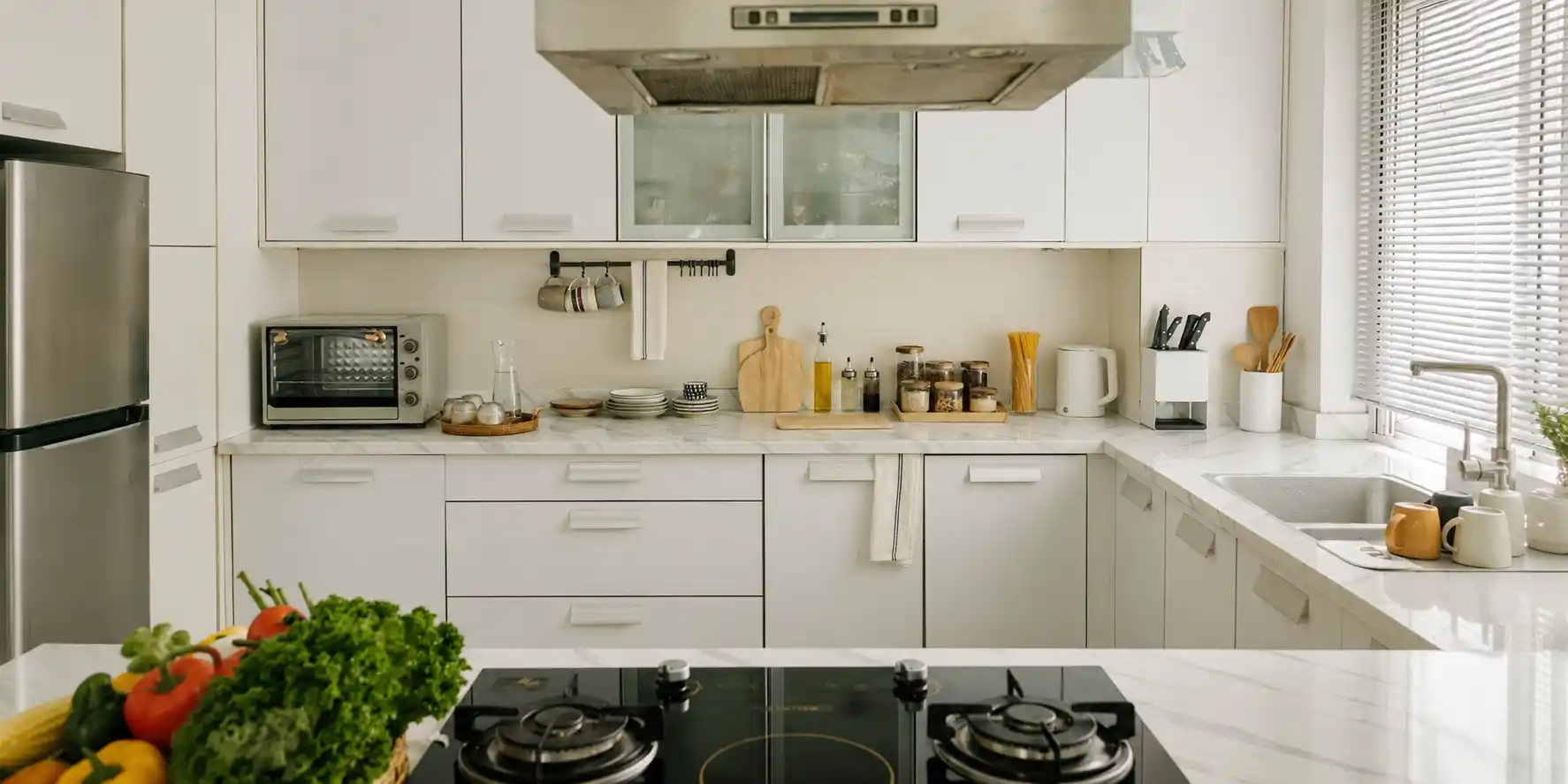 Compact kitchen with organized cabinets, clear countertops, and efficient storage.
